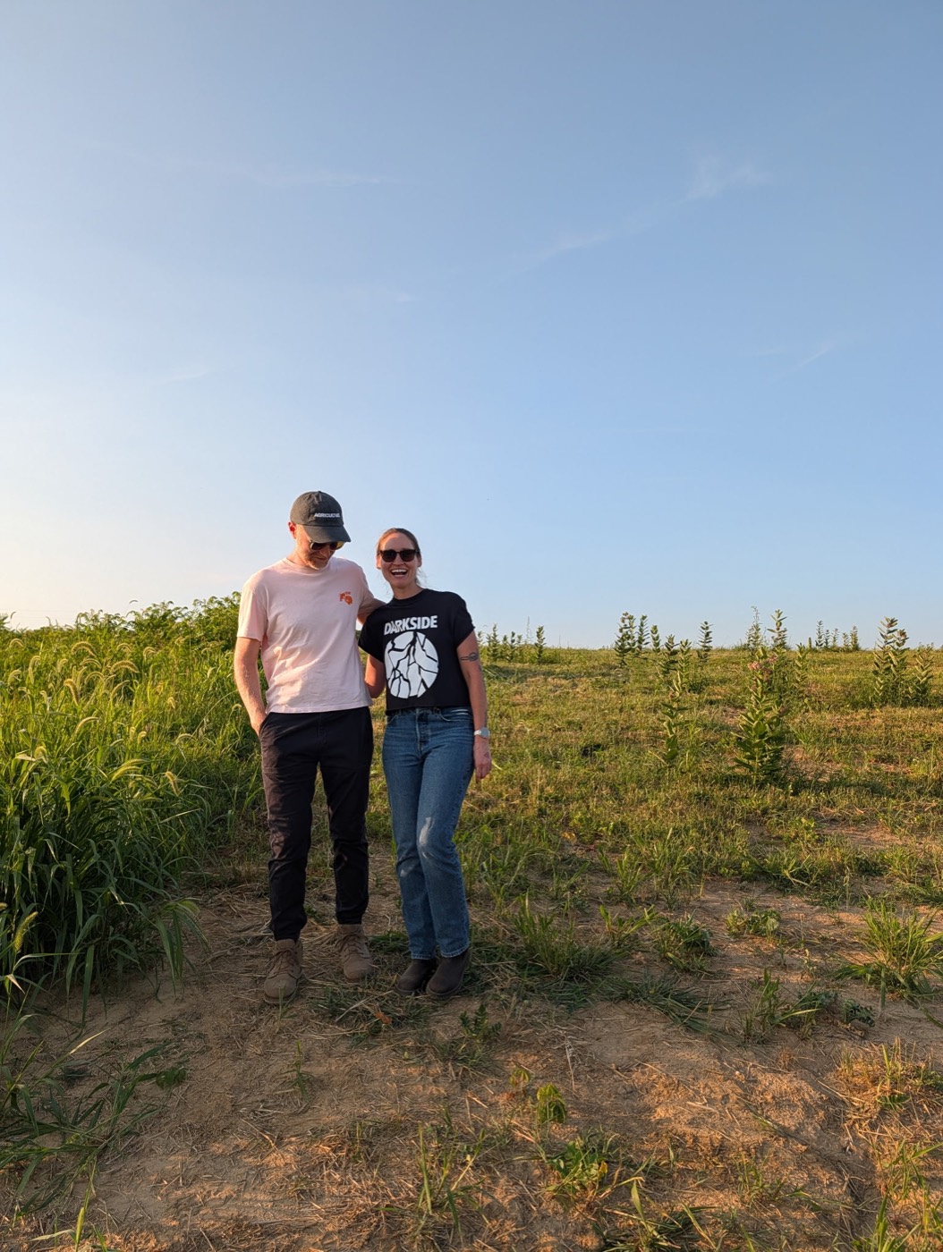 Bailey Fortuna and Jason Young standing together in a vineyard